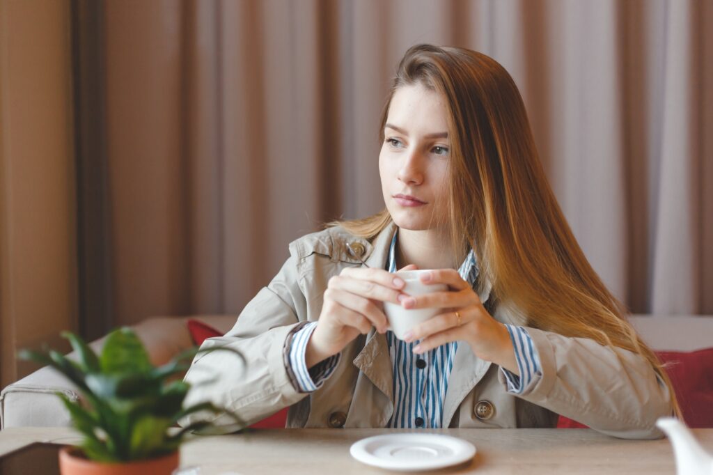 woman drinking tea in the morning at restaurant